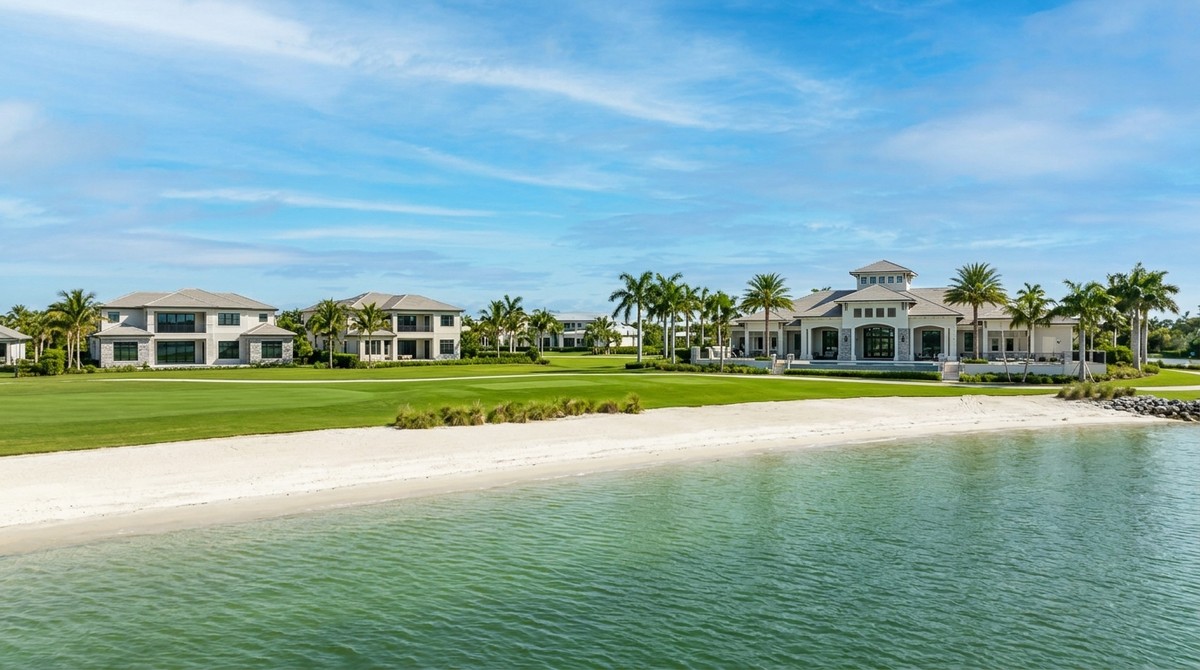 Southwest Florida luxury real estate: a golf course, white sand beach, and large homes by turquoise water.