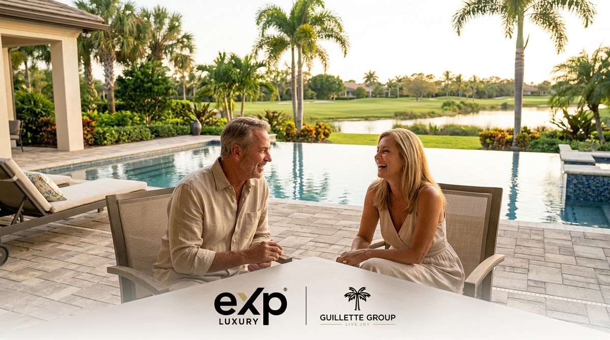 A laughing couple sits by a pool overlooking a golf course and lake, framed by palm trees.